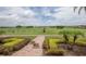 Scenic view of the community golf course with blue skies at 4623 Wandsworth Way, Davenport, FL 33837