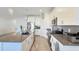 Modern kitchen with a spacious island, stainless steel appliances, and ample cabinet space at 4623 Wandsworth Way, Davenport, FL 33837