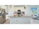 Modern kitchen with a large island, stainless steel appliances, and pendant lighting at 4623 Wandsworth Way, Davenport, FL 33837