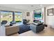 Bright living room with modern fireplace and views of the outdoors through sliding glass doors at 4623 Wandsworth Way, Davenport, FL 33837