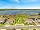 Lakefront homes featuring manicured lawns and direct access to the water at 4717 Weatherbell Rd, Winter Garden, FL 34787