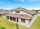 Aerial of the backyard featuring an outdoor kitchen under the covered patio at 4717 Weatherbell Rd, Winter Garden, FL 34787