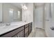 Bathroom featuring double sinks, a large mirror and excellent lighting fixtures at 4717 Weatherbell Rd, Winter Garden, FL 34787