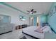 This is a spacious bedroom with a modern ceiling fan and mounted TV at 4717 Weatherbell Rd, Winter Garden, FL 34787