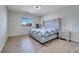 Spacious bedroom with a large, stylish bed and ample natural light at 4717 Weatherbell Rd, Winter Garden, FL 34787