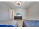 Modern bedroom with a sleek dresser and a flat screen TV displayed at 4717 Weatherbell Rd, Winter Garden, FL 34787