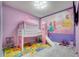Adorable bedroom with a tent bed and colorful alphabet floor mats at 4717 Weatherbell Rd, Winter Garden, FL 34787