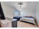 Bright bedroom featuring two beds, a ceiling fan, and modern decor at 4717 Weatherbell Rd, Winter Garden, FL 34787
