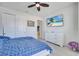 Bedroom with ceiling fan, tv, closet, and a view to hallway with easy access to other areas at 4717 Weatherbell Rd, Winter Garden, FL 34787