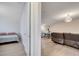Bonus room with ping pong table, couch, and additional bedroom with twin bed at 4717 Weatherbell Rd, Winter Garden, FL 34787