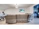 Bonus room boasts TV, ping pong table, couch, and stylish overhead lighting at 4717 Weatherbell Rd, Winter Garden, FL 34787