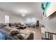 Bonus room boasts TV, ping pong table, couch, and stylish overhead lighting at 4717 Weatherbell Rd, Winter Garden, FL 34787