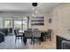 Comfortable dining space featuring a modern chandelier and view of the backyard at 4717 Weatherbell Rd, Winter Garden, FL 34787
