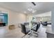 Open dining area with modern chandelier, flows seamlessly into the living space at 4717 Weatherbell Rd, Winter Garden, FL 34787