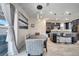 The dining room and kitchen are connected with modern light fixtures hanging at 4717 Weatherbell Rd, Winter Garden, FL 34787