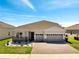 Charming single-story home boasting a three-car garage, a brick driveway and manicured landscaping at 4717 Weatherbell Rd, Winter Garden, FL 34787