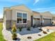 Charming home with a three-car garage and manicured front yard with stone accents at 4717 Weatherbell Rd, Winter Garden, FL 34787