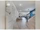 Bright foyer featuring tile flooring, staircase, and views into the open floor plan at 4717 Weatherbell Rd, Winter Garden, FL 34787