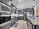Modern kitchen with stainless steel appliances, a large sink, and granite countertops at 4717 Weatherbell Rd, Winter Garden, FL 34787