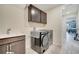 Convenient laundry space with stainless steel washer and dryer at 4717 Weatherbell Rd, Winter Garden, FL 34787