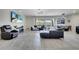 Spacious living room with modern decor and access to outdoor living area at 4717 Weatherbell Rd, Winter Garden, FL 34787