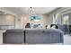 Open living space featuring a large sectional sofa and access to the patio at 4717 Weatherbell Rd, Winter Garden, FL 34787