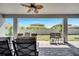 Relaxing covered patio area with outdoor seating and a ceiling fan at 4717 Weatherbell Rd, Winter Garden, FL 34787