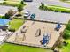 Aerial view of the community playground with slides, swings, and climbing structures at 4717 Weatherbell Rd, Winter Garden, FL 34787