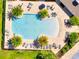 An aerial view of the pool area shows lounge chairs and palm trees for relaxation at 4717 Weatherbell Rd, Winter Garden, FL 34787