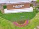Elevated aerial view of the Lakeview Preserve sign with manicured landscaping and flower bed at 4717 Weatherbell Rd, Winter Garden, FL 34787
