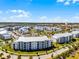 Modern apartment complex featuring manicured lawns, mature trees, plentiful parking, and convenient proximity to nearby lakes at 4721 Clock Tower Dr # 106, Kissimmee, FL 34746