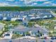 A beautiful aerial view of the Story Lake community clubhouse, pool, and modern homes at 4721 Clock Tower Dr # 106, Kissimmee, FL 34746