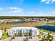 Aerial view of the community featuring lush landscaping and waterfront views at 4721 Clock Tower Dr # 106, Kissimmee, FL 34746