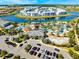 Aerial image featuring resort-style amenities, including pools, water park, and ample parking surrounded by lush landscaping at 4721 Clock Tower Dr # 106, Kissimmee, FL 34746