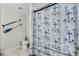 Nautical-themed bathroom with anchor shower curtain and decorative oars at 4721 Clock Tower Dr # 106, Kissimmee, FL 34746