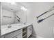 Bathroom features double sinks, white countertops, and nautical decor at 4721 Clock Tower Dr # 106, Kissimmee, FL 34746