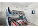 Bedroom featuring a bunk bed with soft linens and a convenient closet for storage at 4721 Clock Tower Dr # 106, Kissimmee, FL 34746
