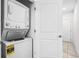 A stacked washer and dryer provides laundry convenience inside the home at 4721 Clock Tower Dr # 106, Kissimmee, FL 34746