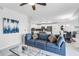 Open concept living area boasts a comfortable sofa, stylish decor, and seamless flow to the kitchen at 4721 Clock Tower Dr # 106, Kissimmee, FL 34746