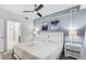 Cozy main bedroom featuring a comfortable bed, decorative wall art, and soft bedside lighting at 4721 Clock Tower Dr # 106, Kissimmee, FL 34746