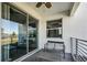 Sliding glass doors open to this covered patio, a perfect spot for enjoying the weather at 4721 Clock Tower Dr # 106, Kissimmee, FL 34746
