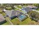 Aerial view of the house featuring a backyard with a private screened-in pool and spacious grassy area at 4873 Old Oak Trl, St Cloud, FL 34771