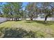 Expansive backyard with lush green grass and a privacy fence, perfect for outdoor activities at 4873 Old Oak Trl, St Cloud, FL 34771