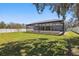 Spacious backyard with a screened-in pool and patio, ideal for outdoor enjoyment and entertaining at 4873 Old Oak Trl, St Cloud, FL 34771