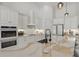 Bright kitchen with a central island, modern appliances, and ample cabinet space at 4873 Old Oak Trl, St Cloud, FL 34771