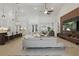 Open concept living room with a modern sectional, stylish lighting, and easy access to the kitchen at 4873 Old Oak Trl, St Cloud, FL 34771