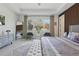Bright main bedroom offering a serene retreat with stylish decor, modern furnishings, and natural light at 4873 Old Oak Trl, St Cloud, FL 34771