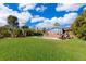 Expansive backyard featuring a private pool and lush greenery at 6051 Twin Lakes Dr, Oviedo, FL 32765