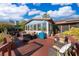 Backyard features patio furniture with a view of the lake, and mature tropical landscaping at 6051 Twin Lakes Dr, Oviedo, FL 32765
