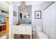 Updated bathroom features stylish vanity, modern lighting, and a shower-tub combo at 6051 Twin Lakes Dr, Oviedo, FL 32765